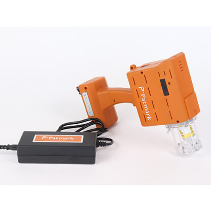 A product image of the orange Patmark-mini lying on the ground with adapter