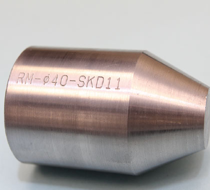Image of round parts engraved with text and numbers 'RM-Ø40-SKD11'