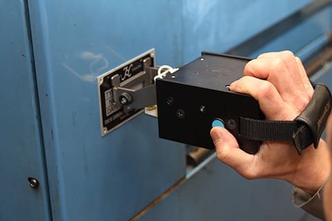 Image of the first model in the Markin BOX series, MB3315, engraving the text on a nameplate on a wall.